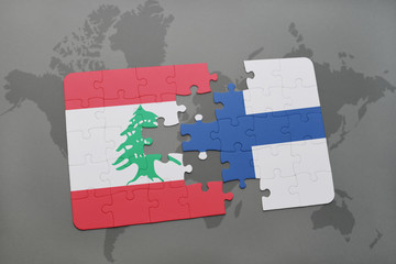 puzzle with the national flag of lebanon and finland on a world map background.