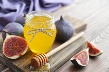 Honey in jar with honey dipper