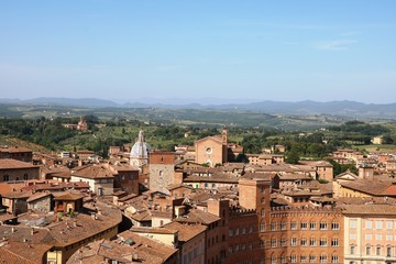 Fototapeta na wymiar View from Piazza del Campo to Basilica di San Francesco in Siena, Tuscany Italy