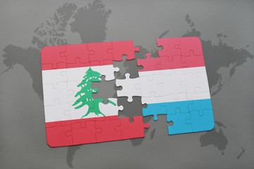 puzzle with the national flag of lebanon and luxembourg on a world map background.
