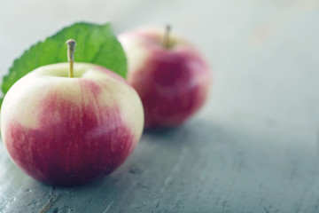 Red apple on wooden background