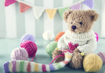 Teddy bear in a woolen sweater