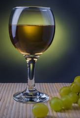 glass of white wine with grapes