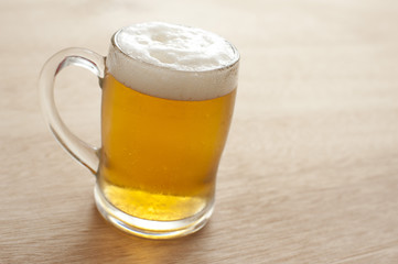 Glass tankard of frothy beer