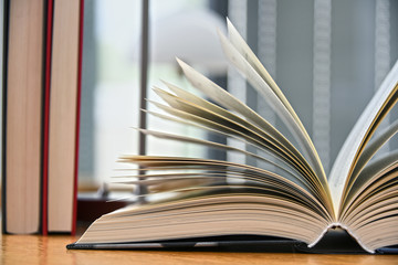 Hardcover book lying on the table in a library