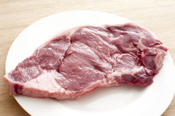 Portion of raw club steak