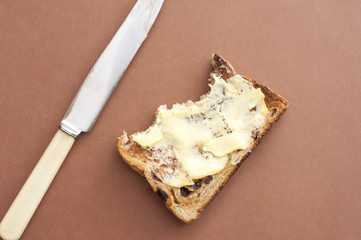 Slice of eaten toast with bite marks