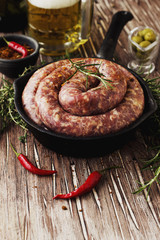 raw beef sausages pan, selective focus