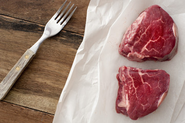 Two medallions of uncooked eye steak