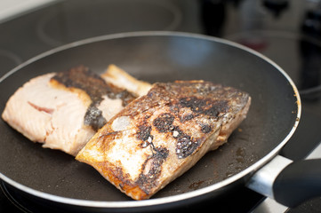 Searing fresh fish in a frying pan