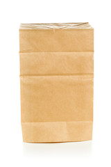 Recycled brown paper bag upside down over white background