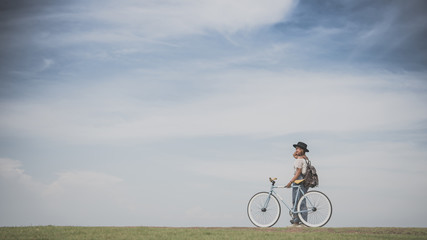   Beautiful Asian girl with vintage bicycle vintage color tone © chayathon2000
