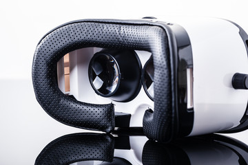 Virtual reality goggles on shiny surface