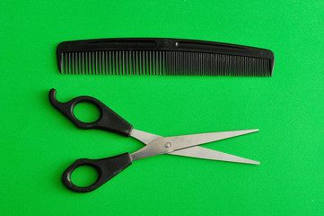 Hair cutting scissors and a comb