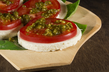 Caprese salad with mozzarella cheese tomatoes and basil