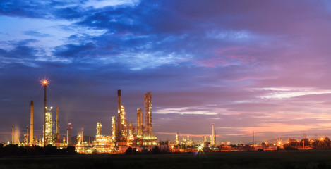 oil refinery, fuel manufacturer with beautiful sunrise or twilig