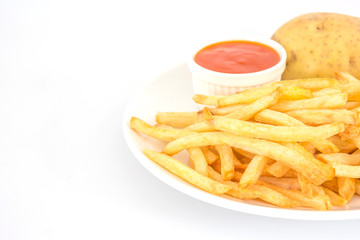 French fries with ketchup and potato on plate