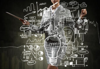 Woman sketching business ideas 