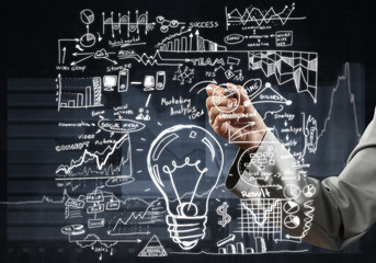 Woman sketching business ideas 