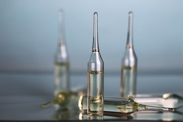 transparent vials of medicine