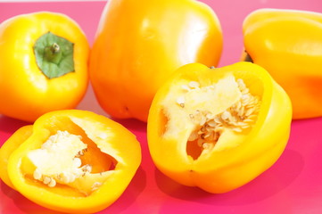 Naklejka na ściany i meble Yellow pepper isolated on a colorful background. Vegetables isolated on background.