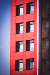 modern building on a background of blue sky with clouds