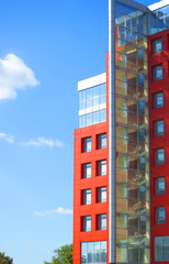 modern building on a background of blue sky with clouds