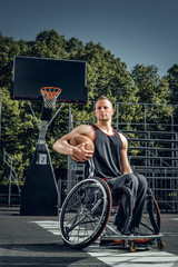 Portrait of cripple basketball player in wheelchair.