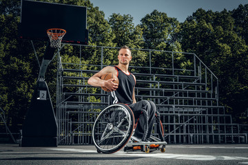 Portrait of cripple basketball player in wheelchair.