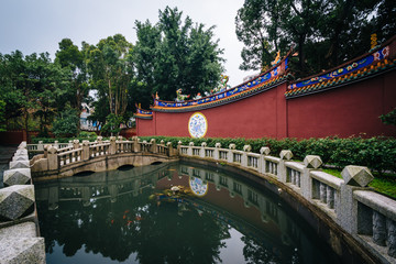 Fototapeta na wymiar Bridge over a small pond at a park in the Datong District, in Ta