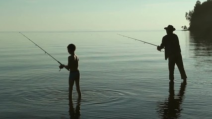Father and son fishing on the lake.