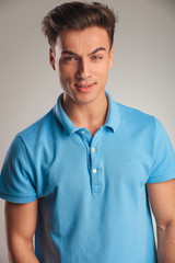 portrait of an angy young casual man in polo shirt