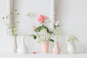  flowers in a vase on white background