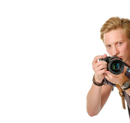 Photographer looks out over the edge with dslr camera isolated on white