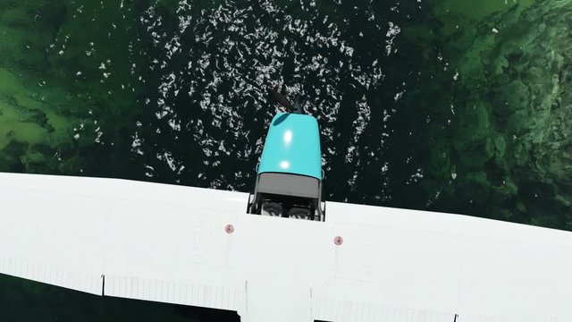 Single-engine plane and flying over dam at daylight from above