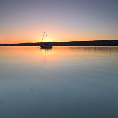 Sailing Boat on Lake at Sunrise