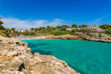 View to the beach of Cala Anguila with turquoise blue water Majorca Spain