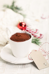 Christmas hot chocolate with cacao and candy cane, closeup, toned