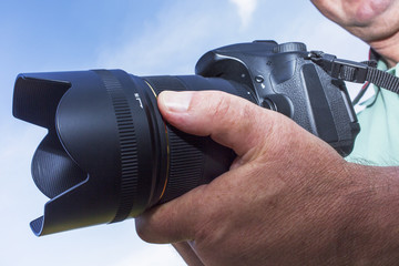 Photographer with a camera when photographing