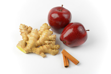 red apples, ginger root and cinnamon sticks