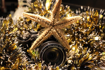 Christmas and new year's tinsel and a camera