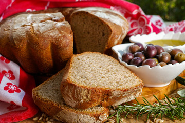 Freshly baked homemade sourdough spelt bread, extra virgin olive