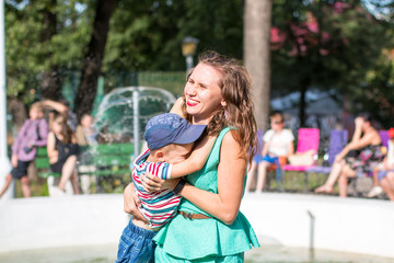 Mom and small boy outdoor in a summer day