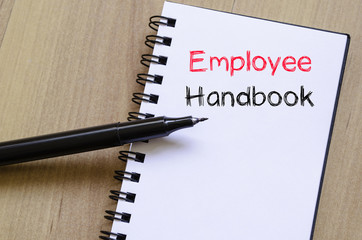 Employee handbook text concept on notebook
