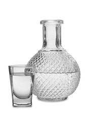 Vodka in a glass and decanter on a white background