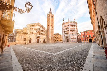 Parma cathedral with Baptistery leaning tower on the central square in Parma town in Italy - obrazy, fototapety, plakaty