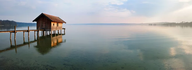 Papier Peint photo Lavable Jetée Fishing Hut by Calm Lake at Sunset, Clouds Reflecting in the Water, Ammersee, Bavaria