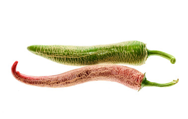 Organic Macedonian Fringed hot chili peppers with green stem.