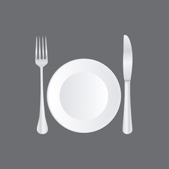 Empty plate with spoon, knife and fork