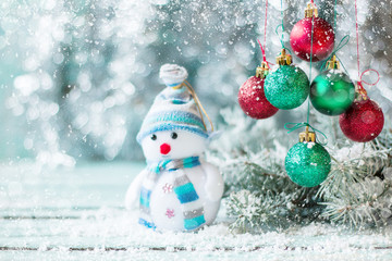Christmas background with decorations on wooden board. Soft focus.
